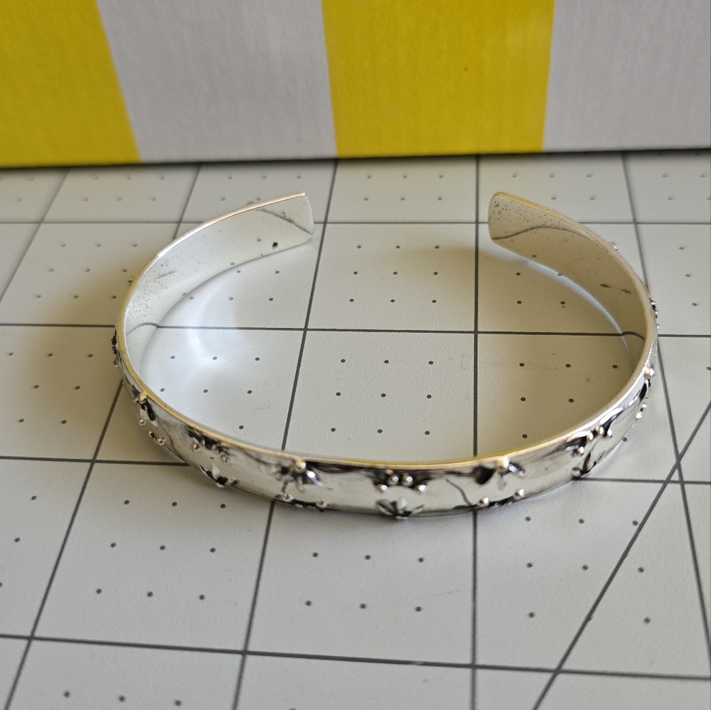 Avon Embossed Silvertone Cuff Bracelet
